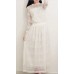 فستان أنيق بتصميم عصري باللون الأبيض ذات أكمام طويلة ورقبة دائرية