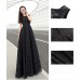 فستان أسود طويل بدون اكمام يمنحكي إطلالة الأميرات
